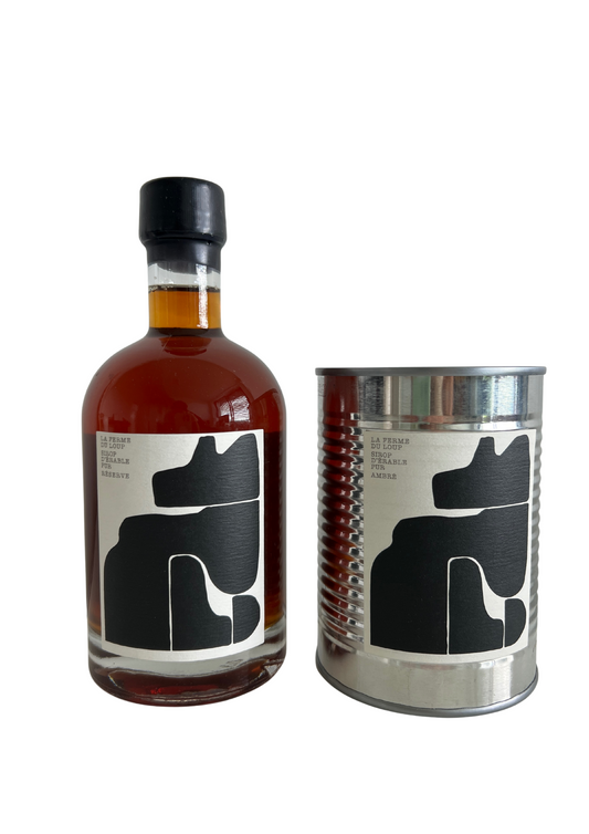 Two maple syrup bottles from la Ferme du Loup, the first on the left is in glass and the second on th right is in a metal can