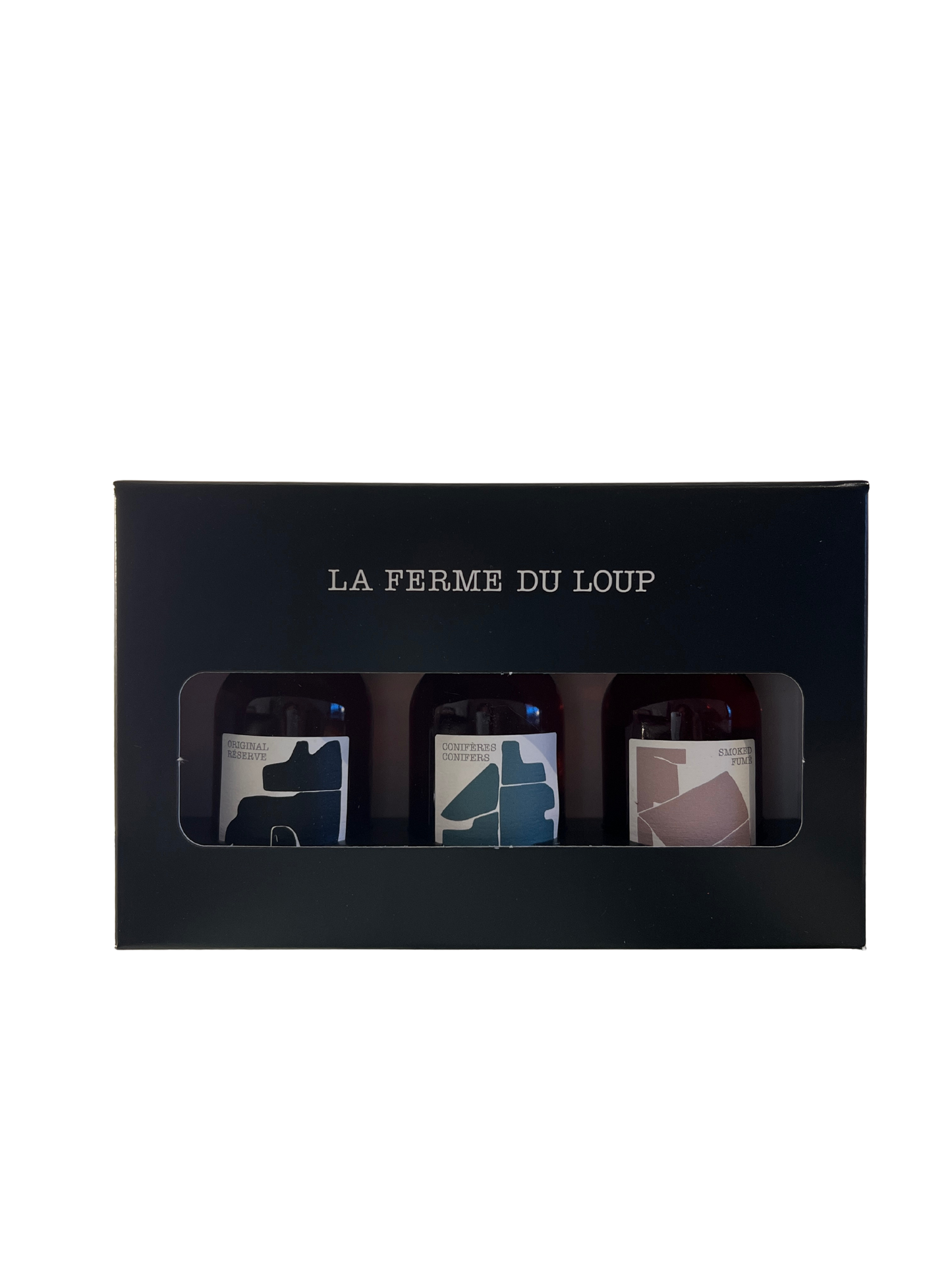 Three small bottles in a black box with 'La Ferme du Loup' branding on a white background.