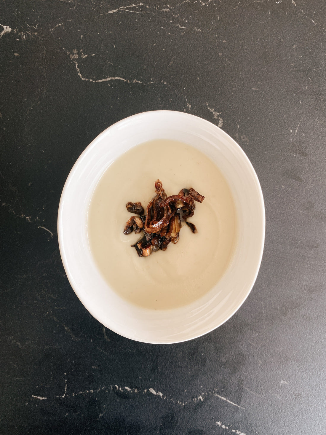 caramelized leeks with maple syrup garnish and soup
