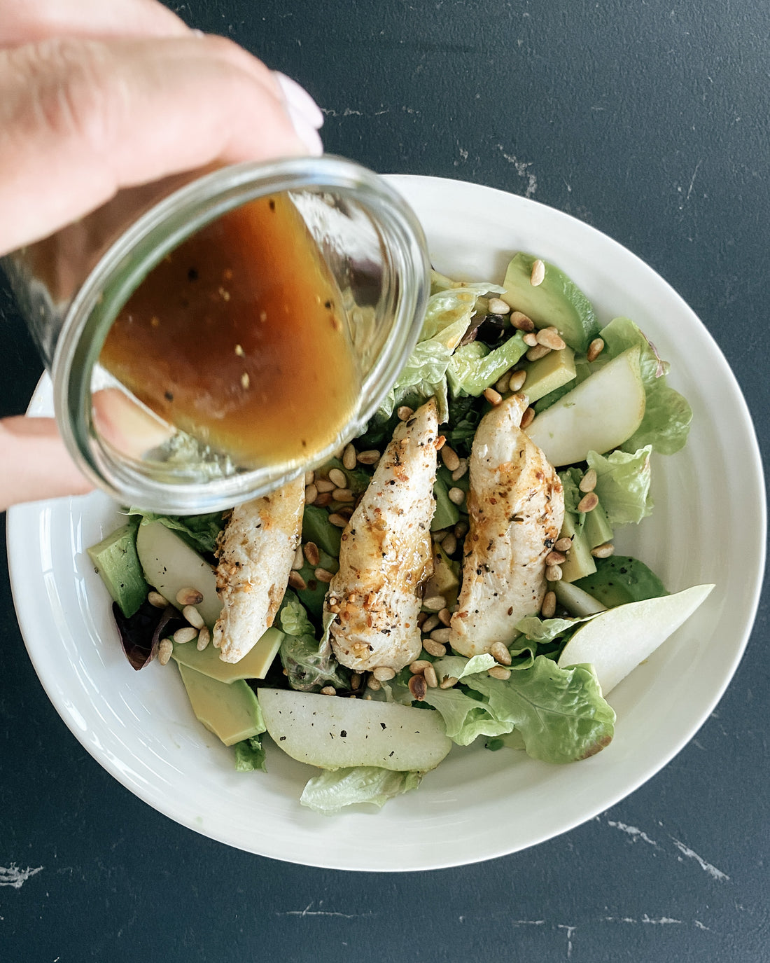 salad with chicken, pears and avocado and maple dressing