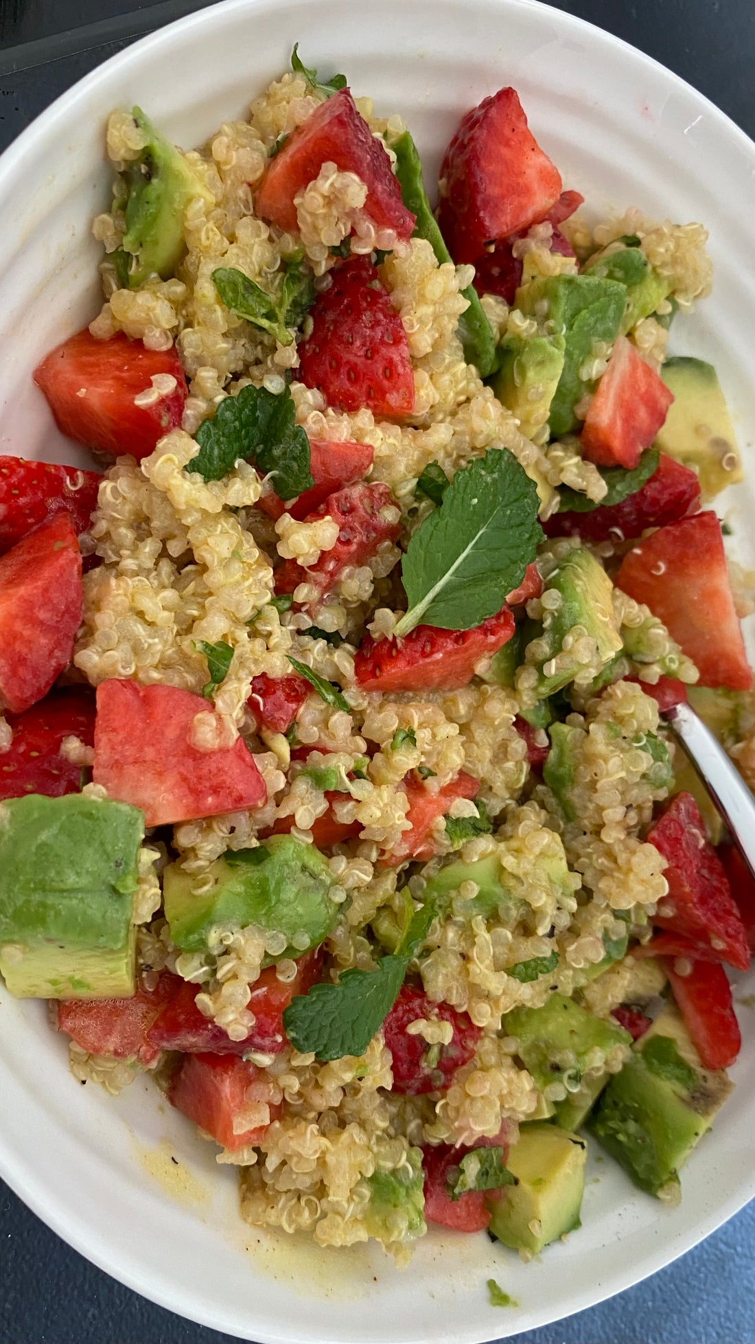 stawberries, avocado, quinoa, mint salad and maple dressing