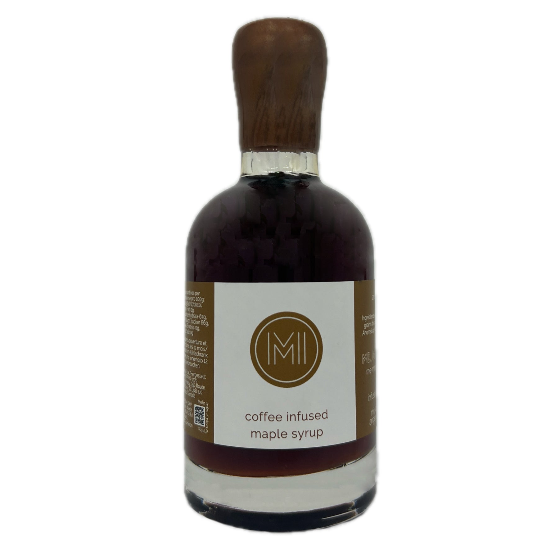 A bottle of coffee-infused maple syrup with a dark brown wooden cap, a white label featuring a gold circular 'MI' logo, and dark brown syrup inside, set against a plain white background.