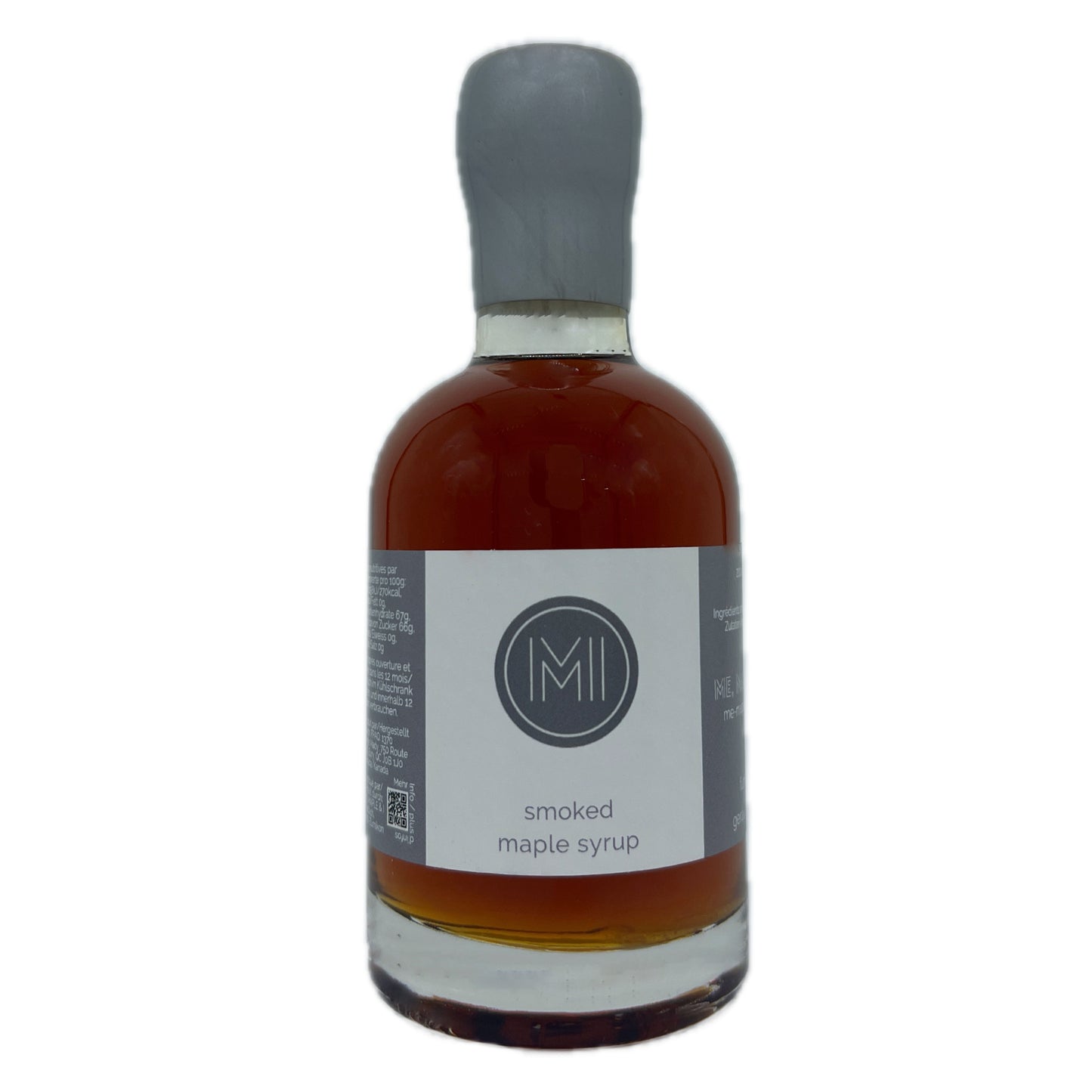 A bottle of smoked maple syrup with amber-brown liquid inside, a white label with a gray logo, and a gray stopper, shown on a plain white background.