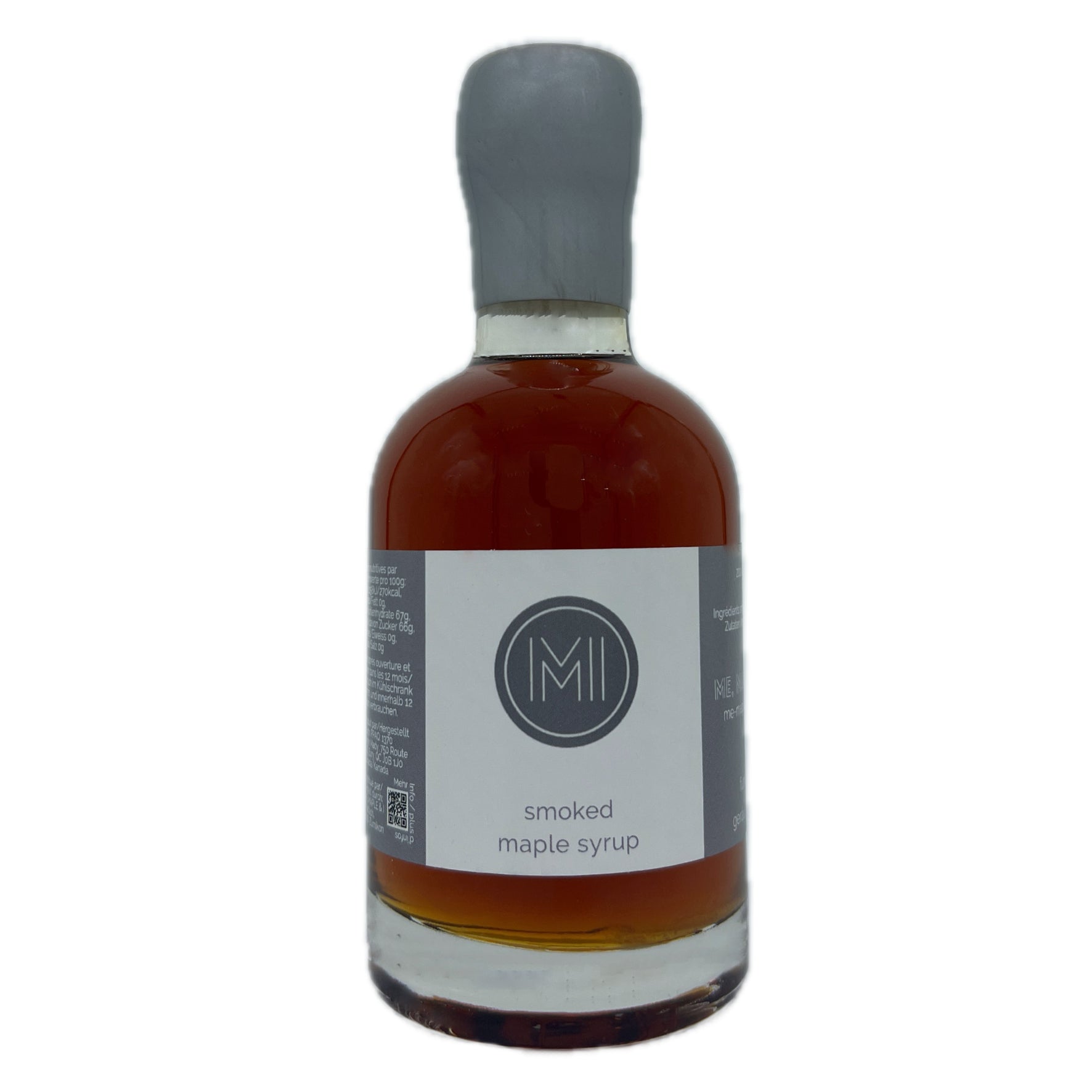 A bottle of smoked maple syrup with amber-brown liquid inside, a white label with a gray logo, and a gray stopper, shown on a plain white background.