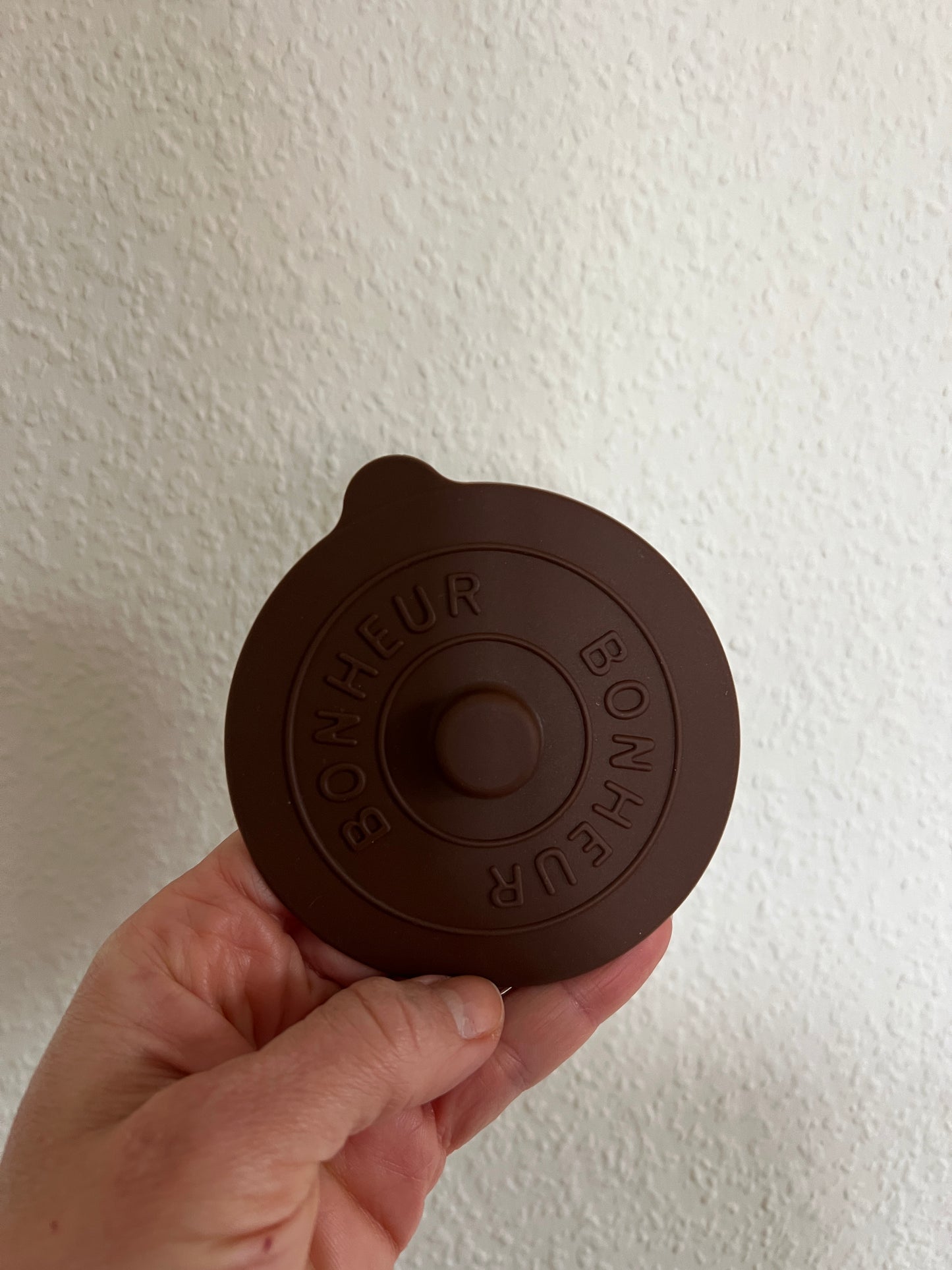 a brown silicon cover on a white backgorund