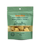 A green stand-up pouch of Bretelles soft maple candies also knows as fondants à l'érable, showing a clear window with the maple leaf-shaped candies inside, on a white background