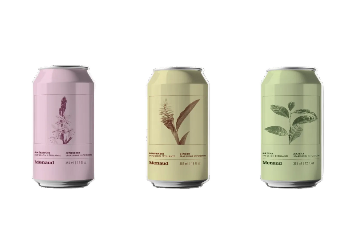 Three slim aluminum cans of Monasoul beverage arranged side by side on a plain white background. The left can is light pink with a floral illustration, the middle can is pale yellow-beige with a botanical illustration, and the right can is pale green with a leaf illustration.