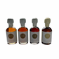 4x50ml side by side bottles of golden, amber, dark and vanilla maple syrup standing with no background