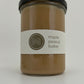 a tall size maple peanut butter jar on a white background
