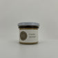 a small size spread jar with white lid on a white background