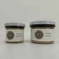 a small size and a medium size maple spread jars with white lids side by side on a white background