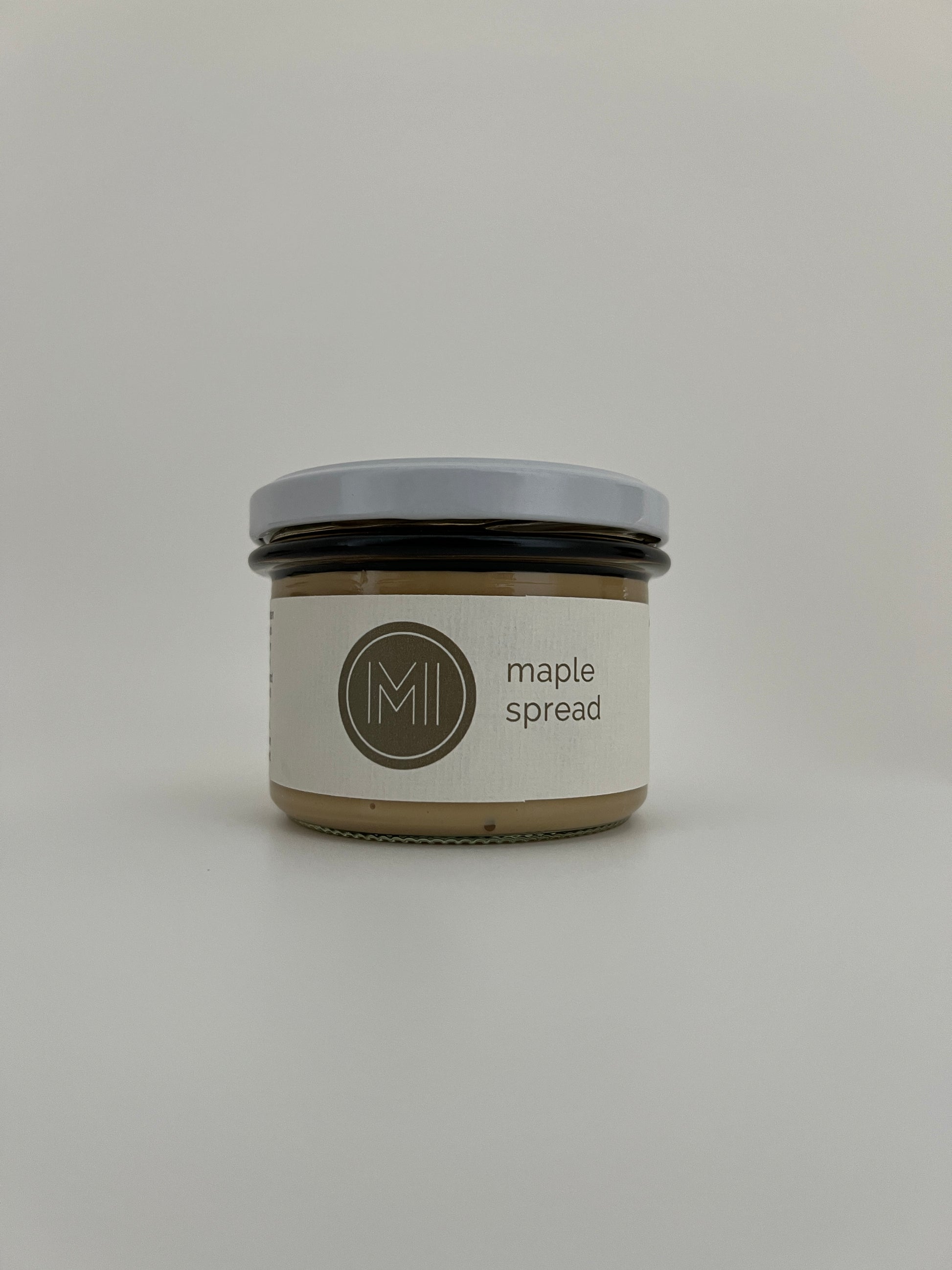 a medium size spread jar with white lid on a white background