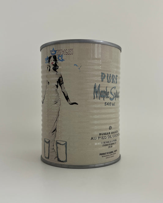 a bottle of amber maple syrup 540ml from Au Pied de Cochon with a lady and a maple leaf blue crown on a white background