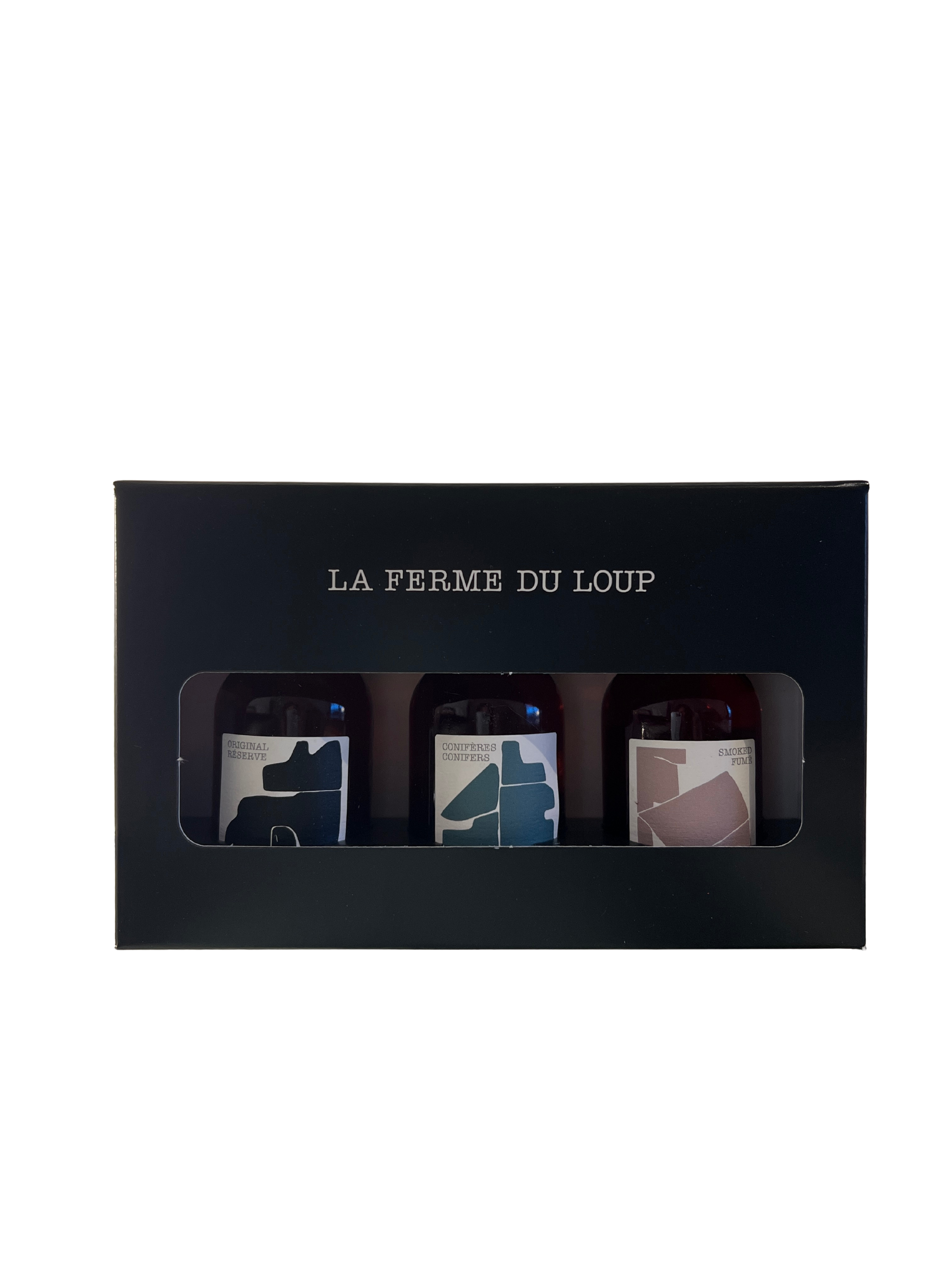Three small bottles in a black box with 'La Ferme du Loup' branding on a white background.