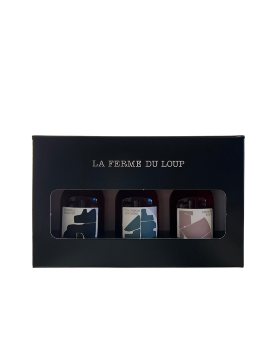 Three small bottles in a black box with 'La Ferme du Loup' branding on a white background.