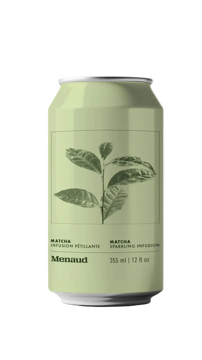 A 355 ml aluminum can of Menaud Matcha Sparkling Infusion beverage, featuring a pale sage green label with a dark green leaf illustration and black text, set against a whit background.