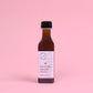 Bottle of 'Les Voiles' on a pink background