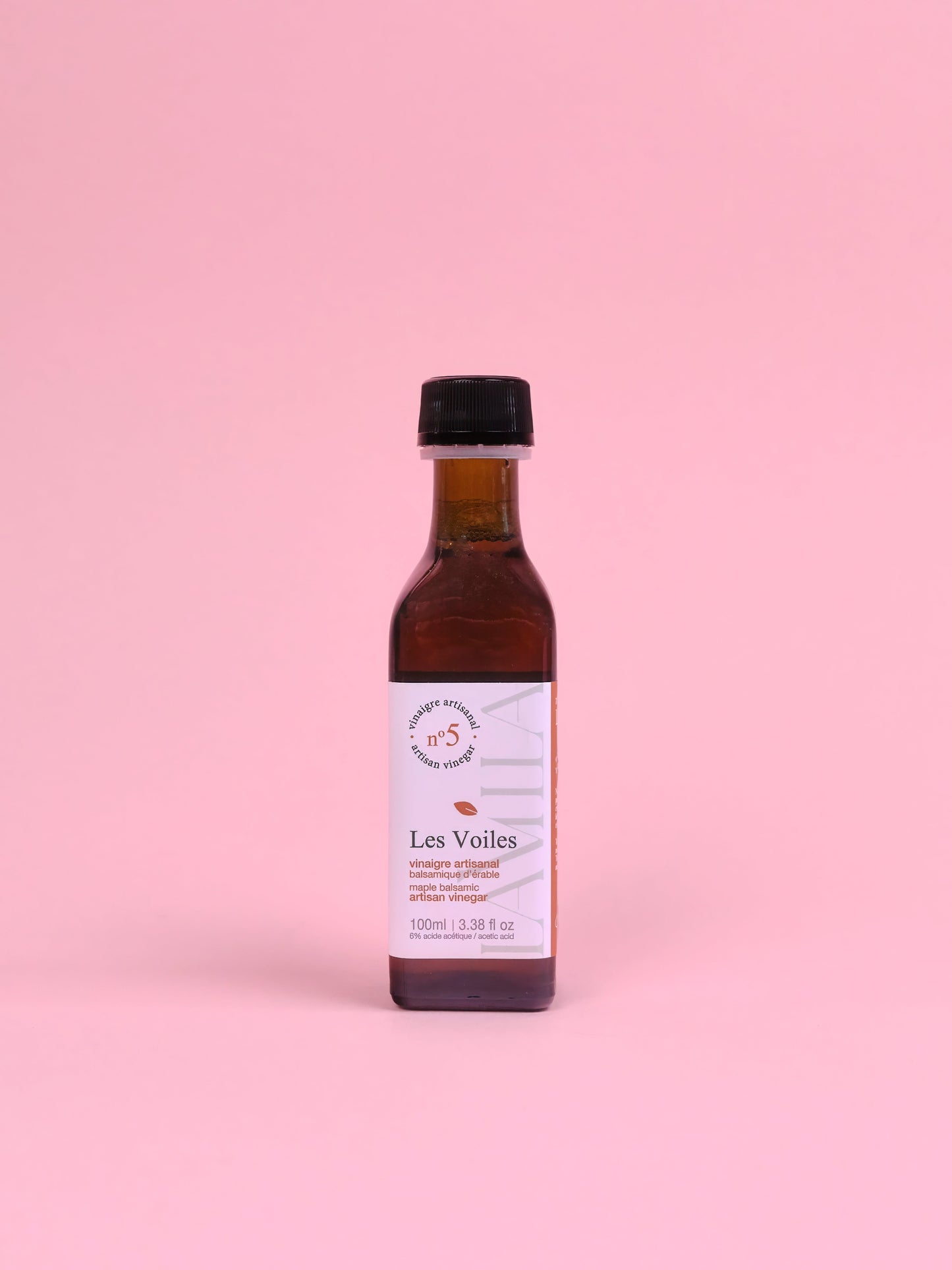 Bottle of 'Les Voiles' on a pink background