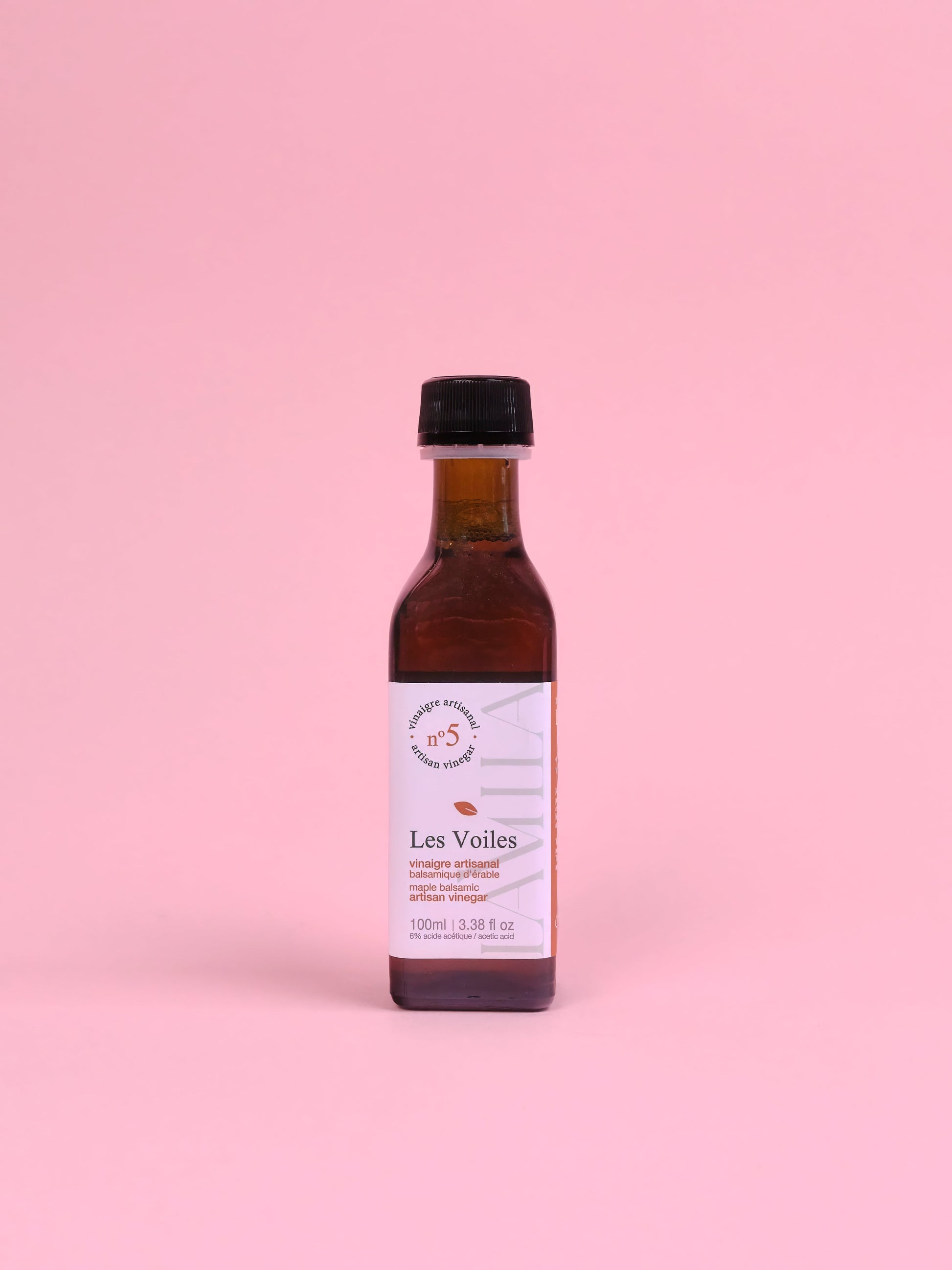 Bottle of 'Les Voiles' on a pink background