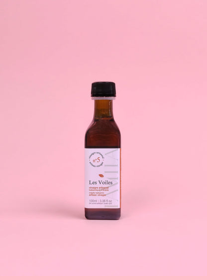 Bottle of 'Les Voiles' on a pink background