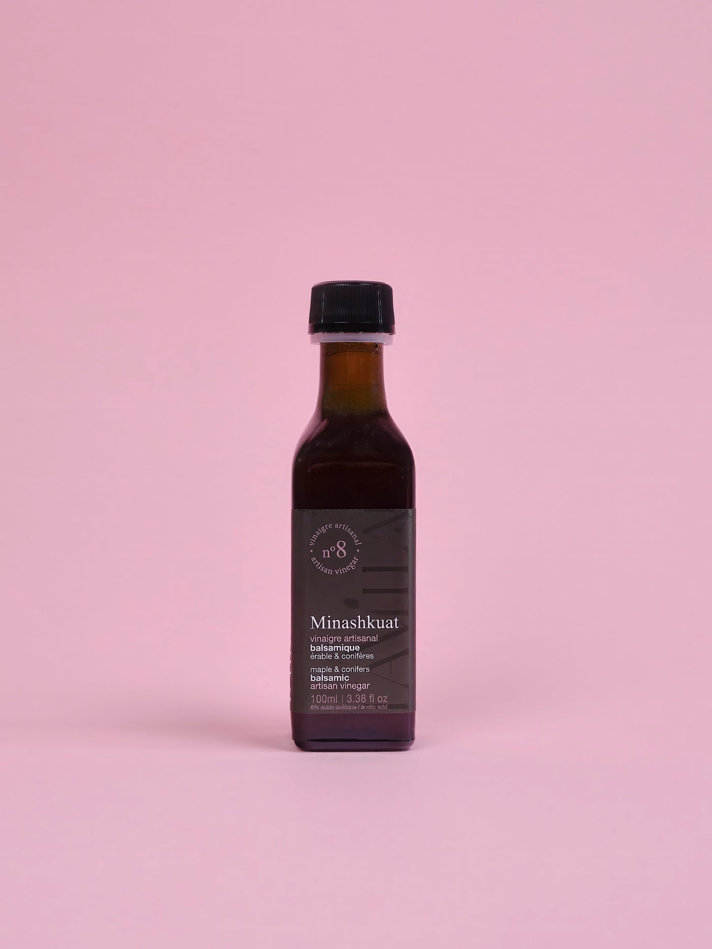 Bottle of Minashkuat on a pink background